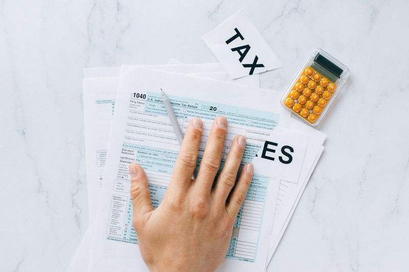 Bookkeeping and Tax Preparation Business For Sale: Best Guide 2026 3 bookkeeping and tax preparation business for sale - tax forms being prepared on desk